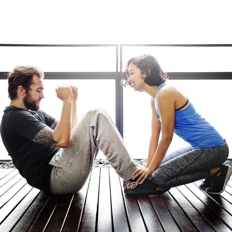 man and woman exercising